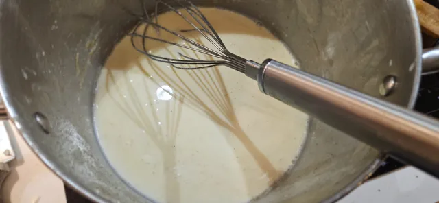 Plated and ready: meatballs in gravy, creamed cabbage, and pea puree.